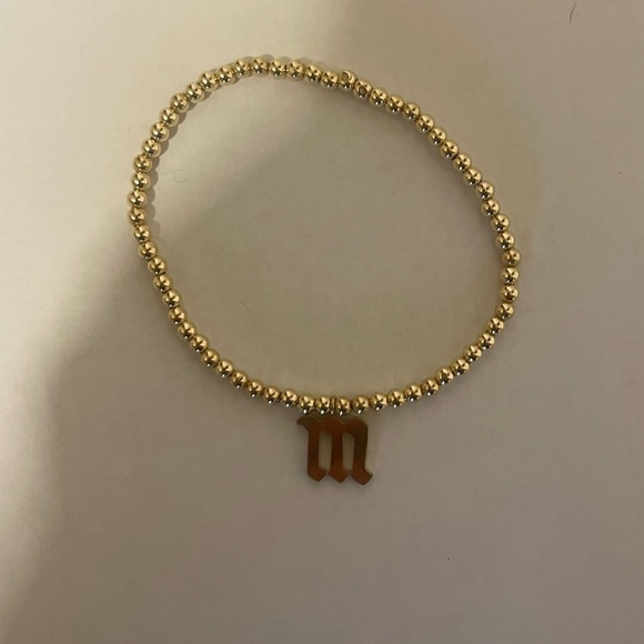 Gold gothic letter M bead stretch bracelet​​​​​ - Picture 1 of 1